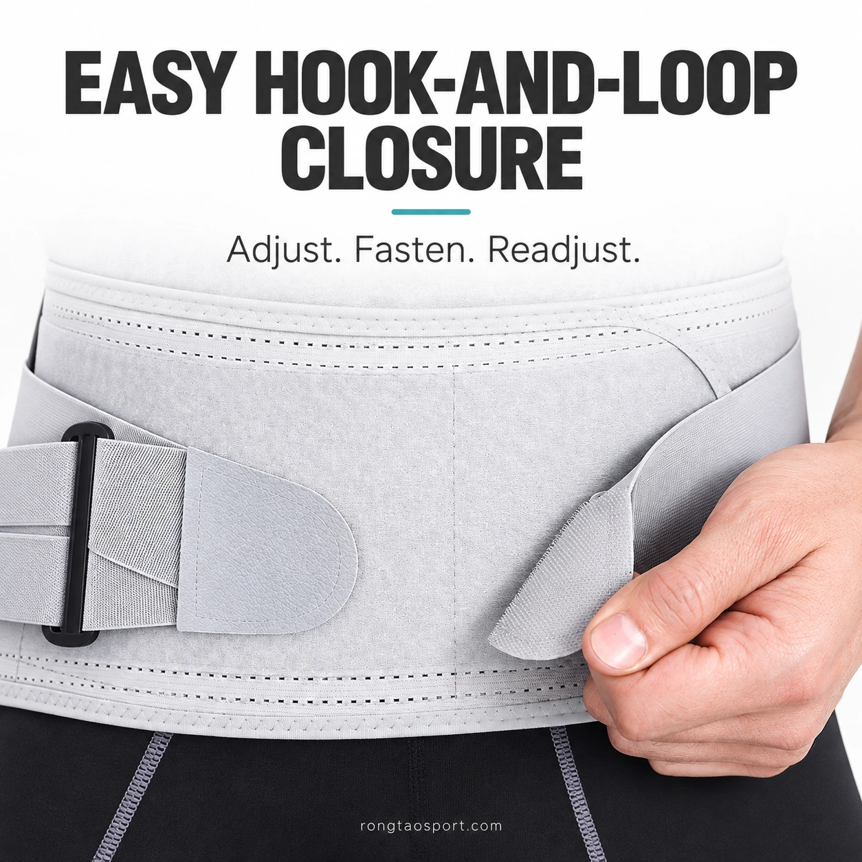 Close-up of the grey belt's adjustable hook-and-loop fastening.